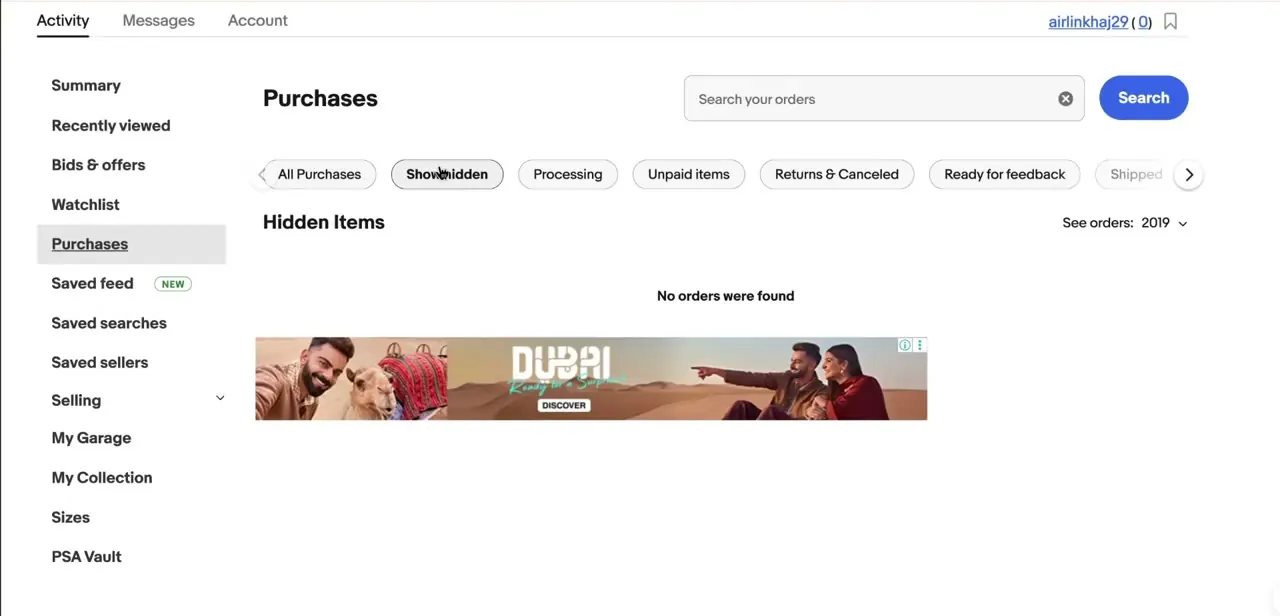 The Purchases page with the Show hidden tab selected, displaying a dedicated Hidden Items section separate from the main order list.
