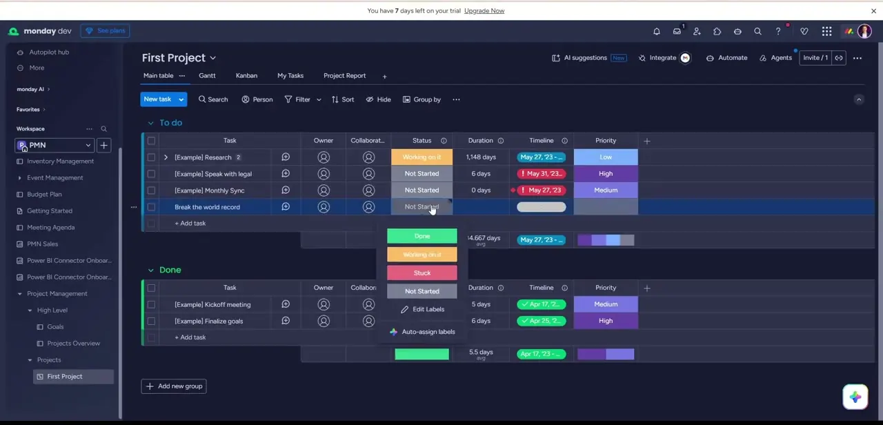 Changing a task's Status inline from a dropdown of colored labels — Done, Working on it, Stuck, and Not Started.