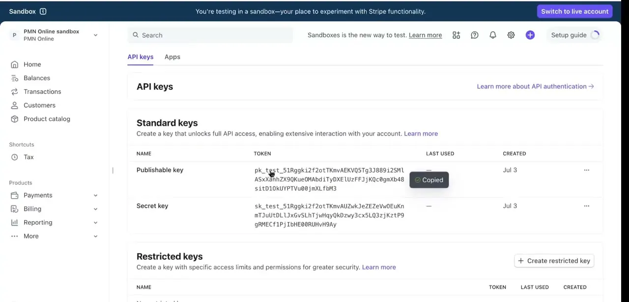 The API keys page under Standard keys, showing the Publishable key and Secret key rows with a "Copied" confirmation after clicking the token.