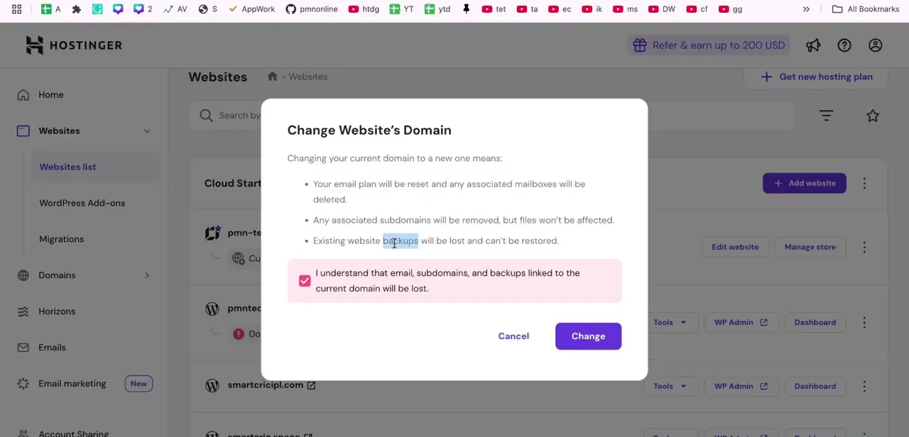 The Change Website's Domain confirmation dialog, listing exactly what gets reset — email, subdomains, and backups — before you can proceed.