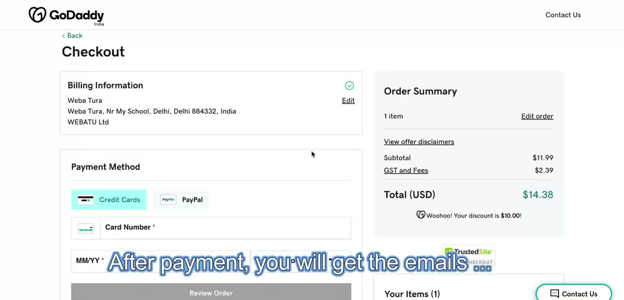 GoDaddy's transfer checkout, showing the domain transfer fee, taxes, and total before the request is submitted.
