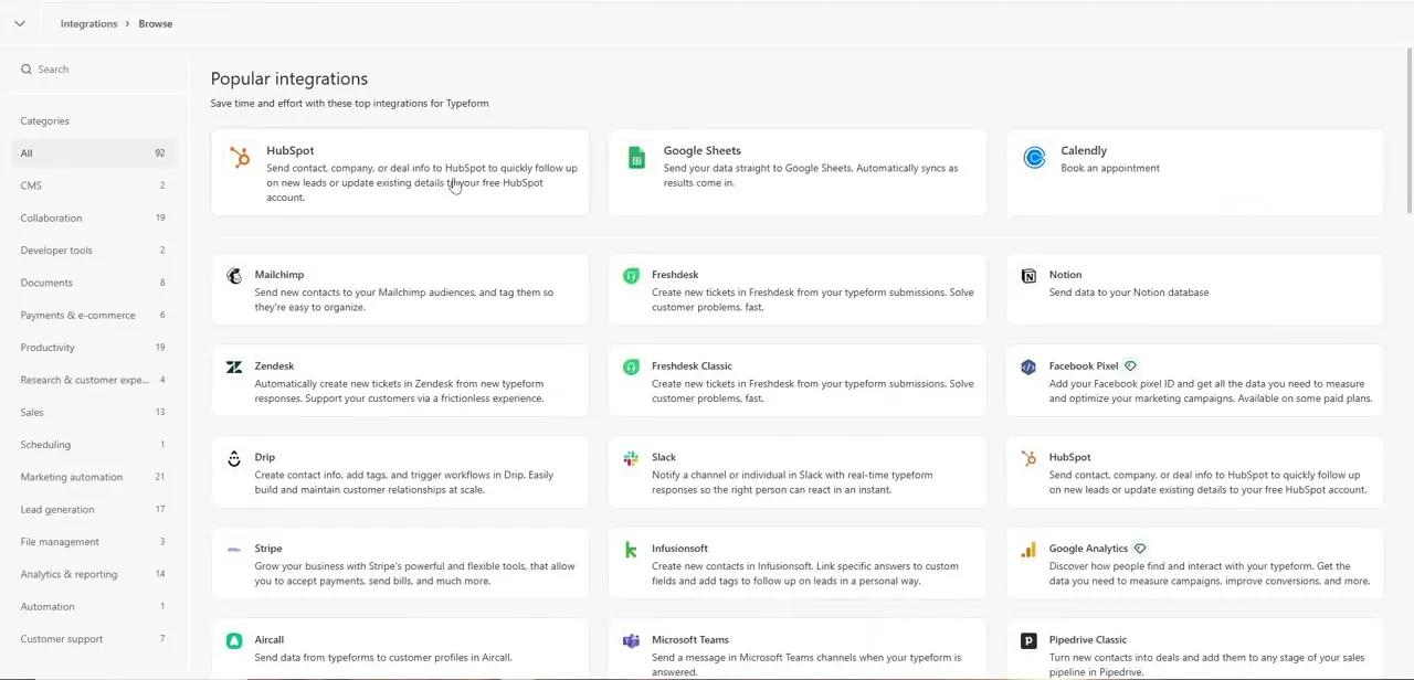 Typeform's Popular integrations browser, filterable by category, showing HubSpot, Google Sheets, Calendly, Mailchimp, and dozens more connected apps.