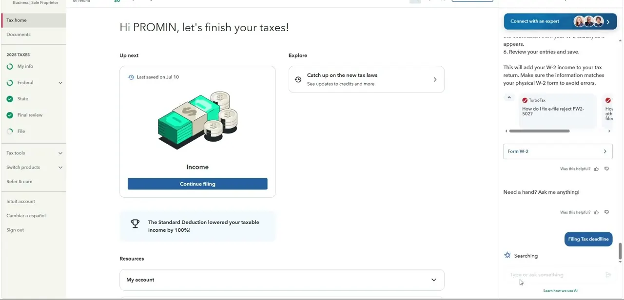 The assistant panel open alongside Tax Home, showing a suggested question about an e-file rejection code and a free-text "ask me anything" box.